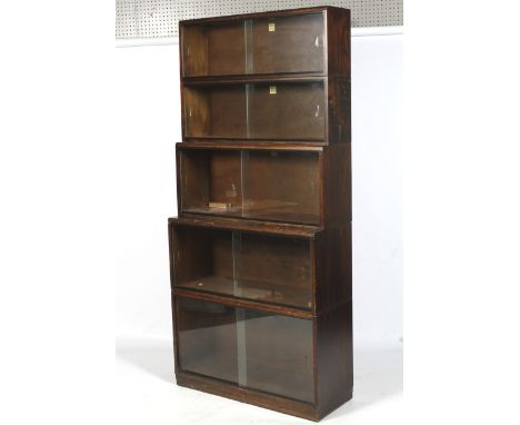 A vintage Simplex five section display bookcase. With sliding glass doors. L91cm x D35cm x H198cm