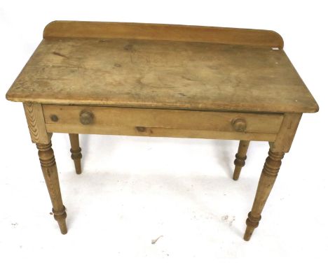 A vintage pine wash stand side table. With single drawer on turned tapering supports. L99cm x D49cm x H74cm Condition Report: