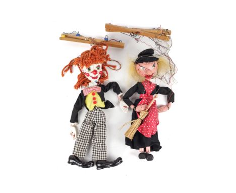 Two vintage Pelham Puppets. Comprising 'Witch' and 'Bimbo' the clown, both in the original boxes, L32cm