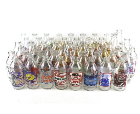A collection of fifty-three assorted vintage advertising milk bottles. Mostly Unigate 568ml. Max. H21cm