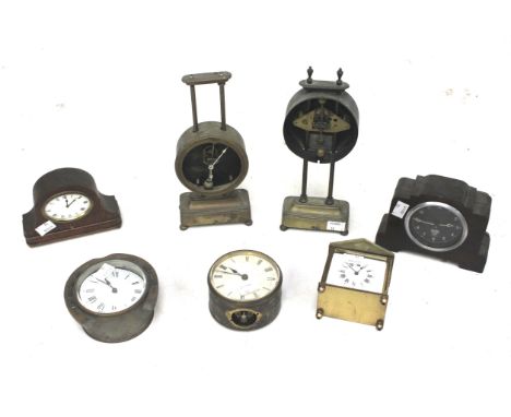 A collection of assorted mantel clocks. Including a Smiths mid-20th century automobile dashboard clock with black dial and wh
