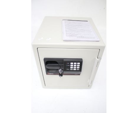 A Sentry S3817 combination key safe and instruction booklet. Key present, comb. 52263, with two adjustable interior shelves. 