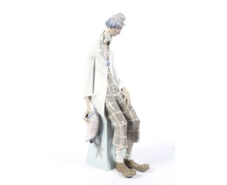 A large Lladro Daisa seated clown. Marked to the underside 'My-7 K', H45cm
