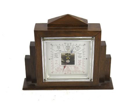 An Art Deco style oak cased mantel or wall hanging aneroid barometer. H16.5cm
