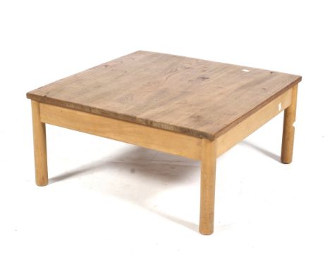 A mid-century Ercol '602' label square coffee table. On turned supports. L69cm x D69cm x H33cm