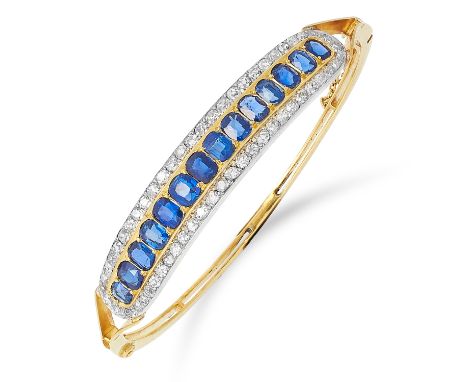 ANTIQUE SAPPHIRE AND DIAMOND BANGLE set with a half band of cushion cut sapphires between rows of old cut diamonds, inner dia