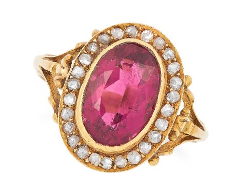 ANTIQUE TOURMALINE AND DIAMOND CLUSTER RING set with an oval cut tourmaline in a border of rose cut diamonds, size K / 5.5, 3