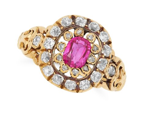 ANTIQUE RUBY AND DIAMOND CLUSTER RING set with an oval cushion cut ruby of approximately 0.80 carats in a border of old and r