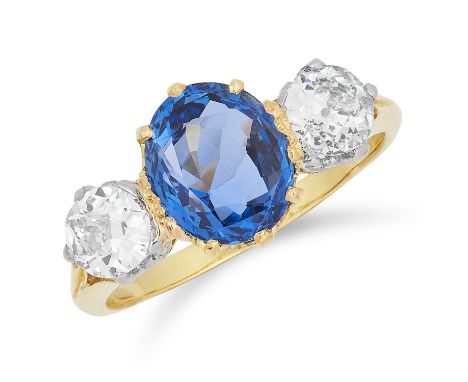 2.31 CARAT CEYLON NO HEAT SAPPHIRE AND DIAMOND THREE STONE RING set with an oval cut sapphire of 2.31 carats between two roun