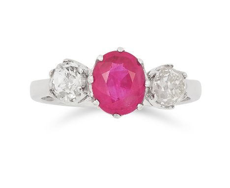RUBY AND DIAMOND THREE STONE RING set with an oval cut ruby of approximately 1.10 carats between two old cut diamonds totalli