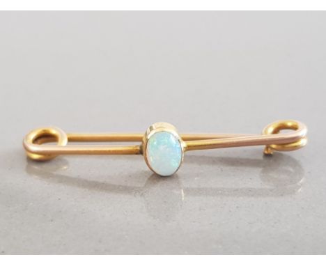 LADIES 9CT YELLOW GOLD OPAL BROOCH FEATURING AN OVAL SHAPED OPAL SET IN THE CENTRE 1.2G GROSS