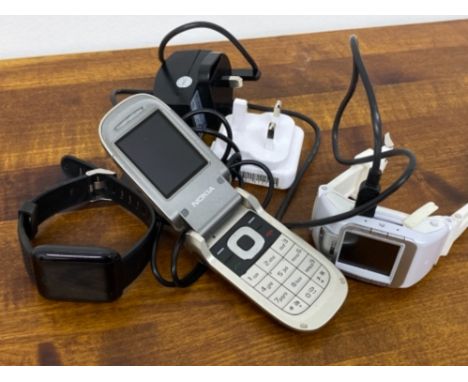 TWO DIGITAL SPORTS WATCHES BOTH HAVE CHARGERS TOGETHER WITH VINTAGE NOKIA FLIP PHONE