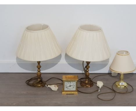 2 BRASS TABLE LAMPS AND 1 BRASS EFFECT LAMP WITH A CARRIAGE CLOCK