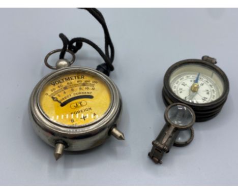 Vintage metal voltmeter together with a french brass compass with binocular mirror and tool set