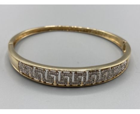 Ladies 9ct yellow gold and diamond set bangle with safety catch approx .25ct 12.7g gross
