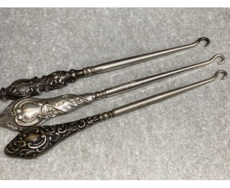 3x hallmarked silver handled button hooks