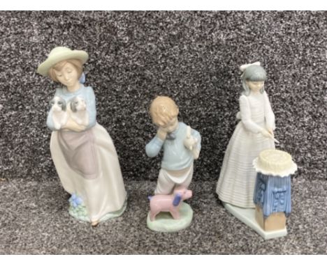 3x Nao by Lladro figures includes 1156 what an armful, 4899 cutting the cake and 1044 boy on the phone with puppets, all with
