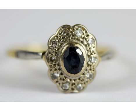 An antique 18ct yellow gold and platinum sapphire and diamond set cluster ring, (M.5).