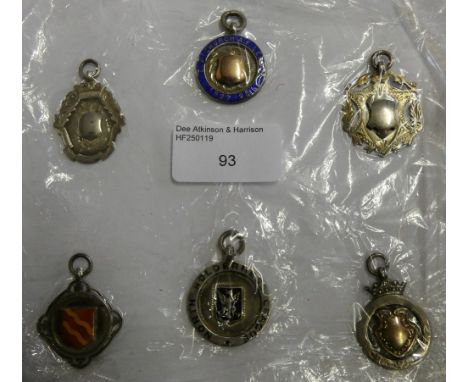 Six silver and enamel fob medallions including Noal Holderness League, inscribed '1st Division Hornsea Utd Winners 1922-1923'