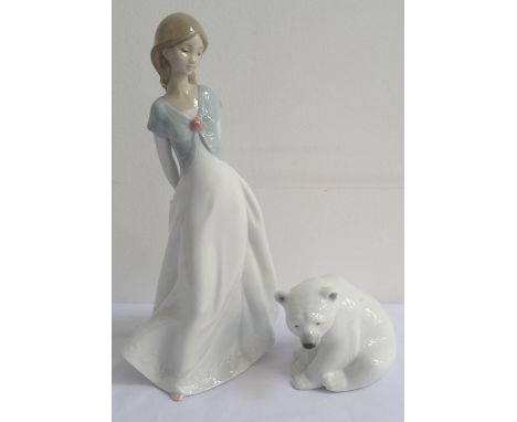 LLADRO POLAR BEARsat on its haunches, 8.5cm high, together with a Nao figurine of a young girl, 25cm high (2) 