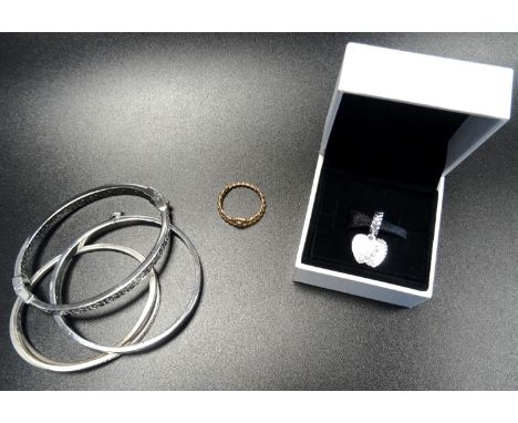 SELECTION OF PANDORA AND OTHER FASHION JEWELLERYcomprising a boxed Pandora 'The Future is Bright' heart charm; a CZ set Entwi