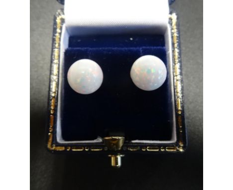 PAIR OF OPAL STUD EARRINGSeach formed with a spherical opal, on nine carat gold mounts 