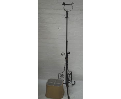 PAINTED WROUGHT IRON ADJUSTABLE LAMP STANDraised on three scroll supports with applied flower head decoration, the top with t