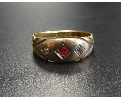 EDWARDIAN GYPSY STYLE RUBY AND DIAMOND RINGthe central ruby flanked by diamonds, in fifteen carat gold, ring size L-M 