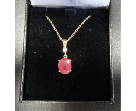 RUBY AND DIAMOND PENDANTthe oval cut ruby approximately 3cts below a round brilliant cut diamond of approximately 0.1ct, in n