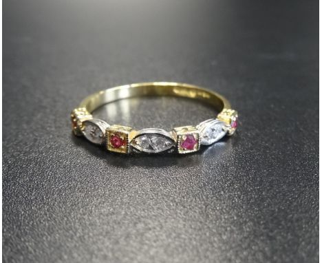 RUBY AND DIAMOND HALF ETERNITY RINGthe four rubies alternating with the three diamonds, on eighteen carat gold shank, ring si