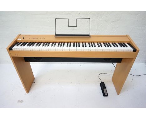 ROLAND F-90 DIGITAL PIANOin a maple style case with an eight eight note digital piano hammer action key board with upper and 