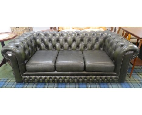 GREEN LEATHER CHESTERFIELD SOFAwith a button back and arms with decorative stud detail, on castors, 190cm wide 
