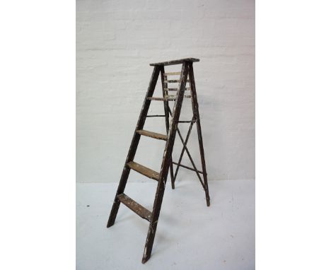 'A' FRAME WOODEN STEPLADDERwith four shaped steps and a fold out slatted shelf 