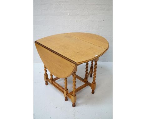 LIGHT OAK DROP LEAF DINING TABLEthe top 119cm long (open) x 92cm wide, with barley twist leg structure 