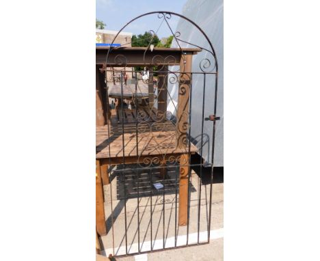 A wrought iron gate, with curved and scroll design with plain bars, 185cm high, 88cm wide. 
