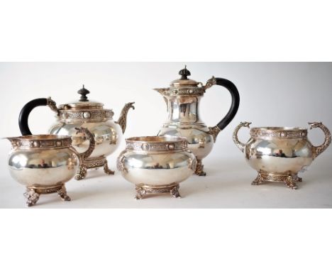 A SILVER COMPOSITE FIVE PIECE IRISH TEA SET (5)Comprising; a teapot, a hot water jug, a twin handled sugar bowl and a milk ju