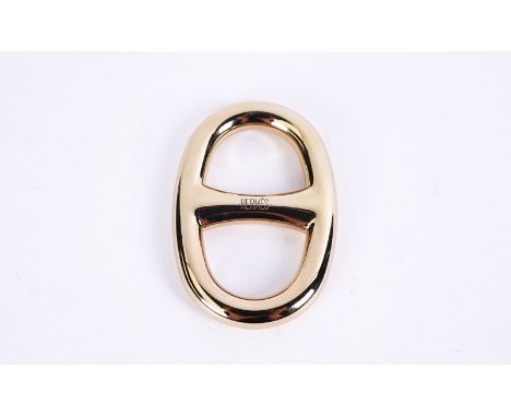 A HERMES D-ANCHOR GILT-METAL SCARF RINGwithin it's original case5.5cm x 3.5cmCondition:- Good overall with light surface scra