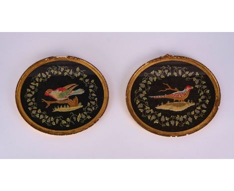 A PAIR OF OVAL SILK WORK PICTURES OF PARROTS  (2)First half 19th CenturyMounted in gilt composition frames, 36.5cm wide; 31.5