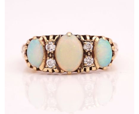 A 9CT GOLD, OPAL AND DIAMOND RINGMounted with three oval opals and with two pairs of circular cut diamonds, mounted at interv