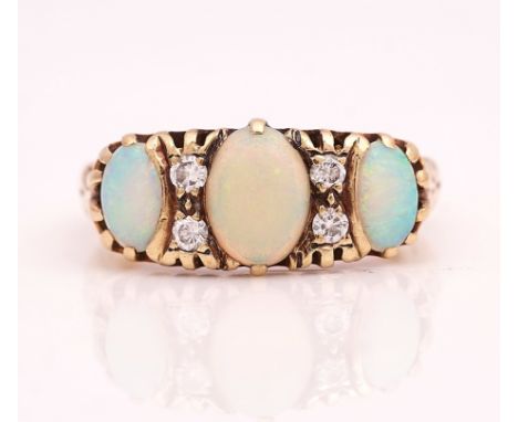 A 9CT GOLD, OPAL AND DIAMOND RINGMounted with three oval opals and with two pairs of circular cut diamonds, mounted at interv