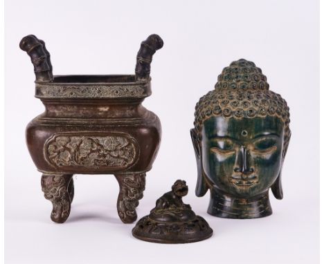 A SOUTH-EAST ASIAN GREEN PATINATED METAL HEAD OF BUDDHA AND A BRONZE JARDINIERE (3)Late 20th CenturyThe head, 27cm high; the 