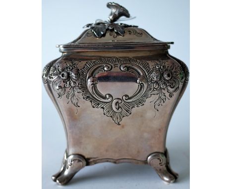 A VICTORIAN SILVER TEA CADDYOf shaped rectangular bombe form, with floral, foliate and scroll embossed decoration, raised on 