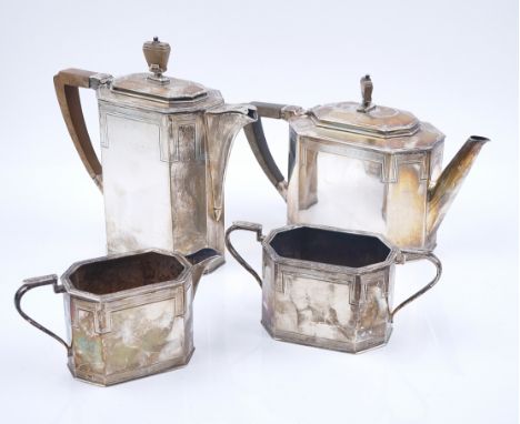 A SCOTTISH SILVER FOUR PIECE TEA SETComprising; a teapot, a hot water jug, a twin handled sugar bowl and a milk jug, each pie