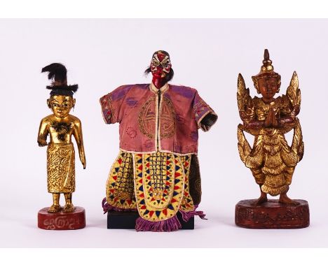 A GROUP OF FOUR SOUTH-EAST ASIAN FIGURES AND A PAIR OF GILT LACQUER SCROLL HOLDERS (6)20th Century and laterIncluding a paint