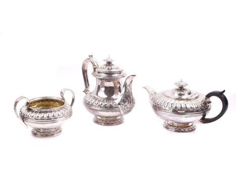 A SILVER COMPOSITE FOUR PIECE TEA SETComprising; a teapot, London 1823, a hot water jug, London 1825, a twin handled sugar bo