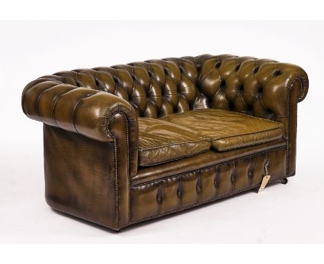 A GREEN LEATHER UPHOLSTERED BUTTON-BACK CHESTERFIELDWith studded decoration, 175cm wide; 75cm highCondition report:&nbsp;This