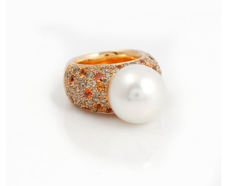 A GOLD, SOUTH SEA CULTURED PEARL, DIAMOND AND ORANGE SAPPHIRE RINGMounted with the large South Sea cultured pearl to the cent