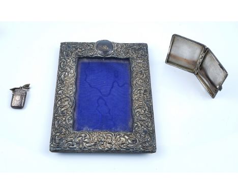 A SILVER MOUNTED RECTANGULAR PHOTOGRAPH FRAME AND TWO FURTHER ITEMS (3)The photograph frame with scroll pierced decoration, t