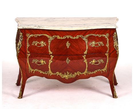 A LOUIS XV STYLE GILT-METAL MOUNTED KINGWOOD COMMODEThe serpentine marble top over a bombe-shaped two drawer base, 125cm wide