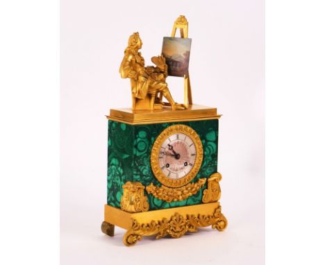 A RESTAURATION MALACHITE VENEERED ORMOLU MOUNTED  STRIKING MANTEL CLOCKCirca 1830The case surmounted with a figure of an arti